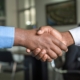 SME succession cross-border M&A business executives signing international contract