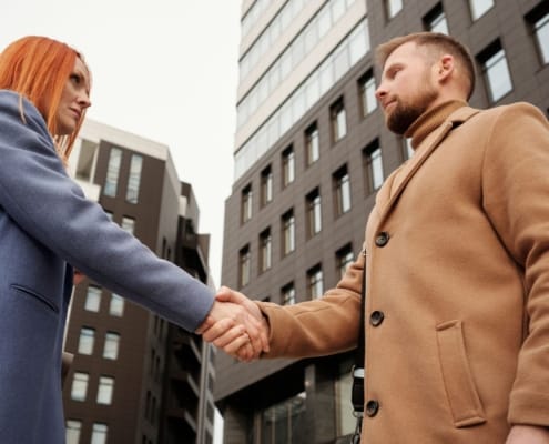 founder transitions cross-border business handshake deal closing