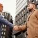 founder transitions cross-border business handshake deal closing