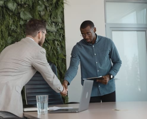valuation gaps cross-border M&A corporate boardroom negotiation business