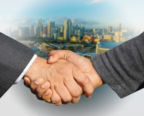 founder transitions business handshake deal closing formal suits founder transitions business handshake deal closing formal suits